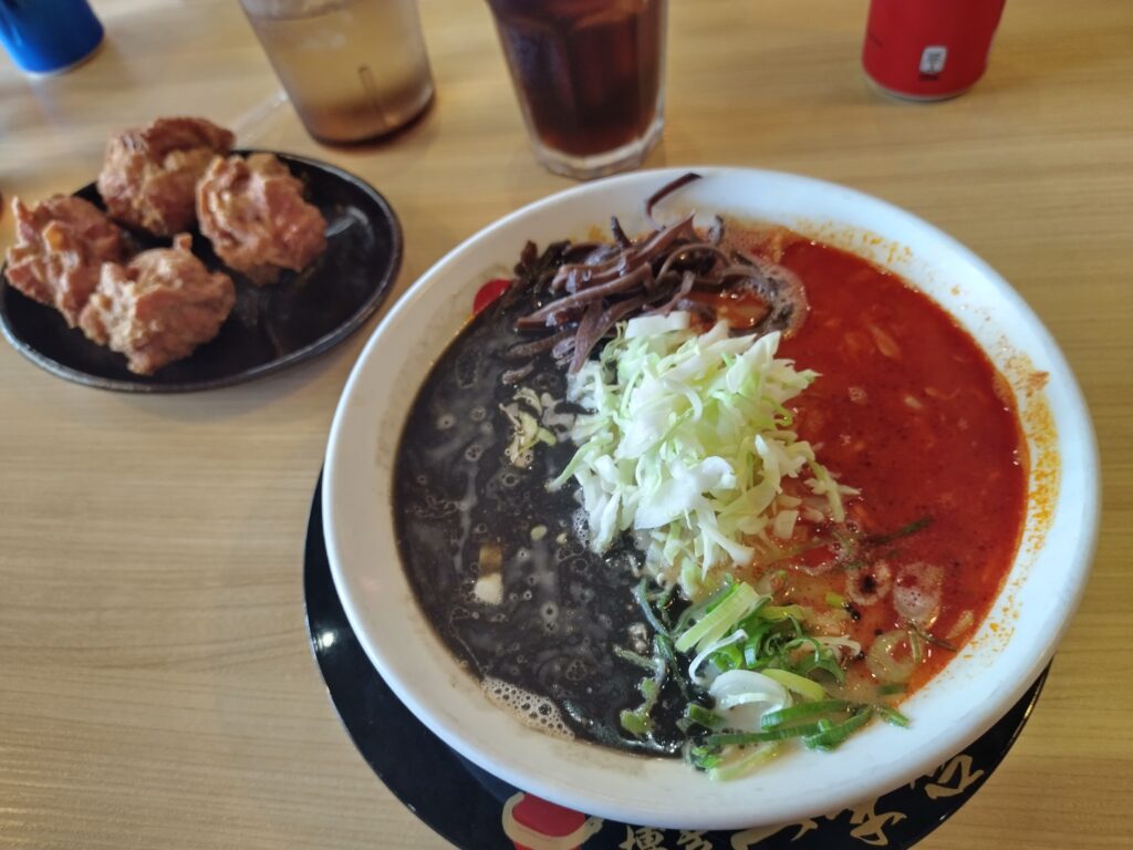 A bowl of ramen with a side of chicken karaage